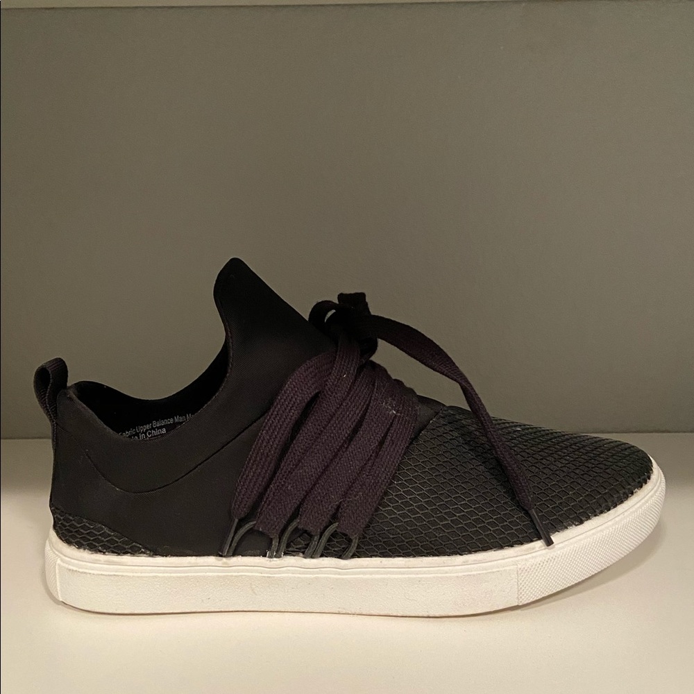 Black slip on casual sneakers.